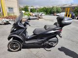 a scooter that is parked in a parking lot