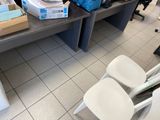 a table with a bunch of boxes on it and a chair in front of it