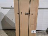 a cardboard box sitting on the floor in front of a garage door
