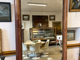 a large mirror sitting on a table in a room