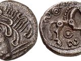 a silver coin with an image of a man on it