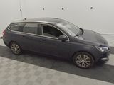 an image of a grey car parked in a garage