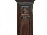 a tall wooden grandfather clock with a blue face