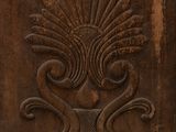 an old wooden door with a decorative design on it