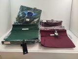 three bags of clothing are sitting on a shelf in a store