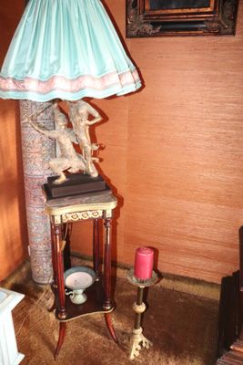 a lamp that is sitting on a table in a room