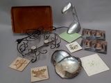 a table with a lamp, cards, and other items on it