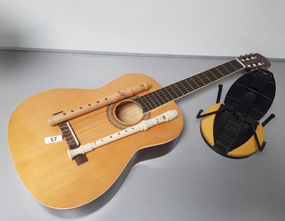 a guitar and a microphone sitting on a table