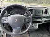 a steering wheel and dashboard of a car with a clock on it