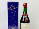 a bottle of wine that is next to a box