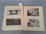 an open book with pictures of a table and other furniture