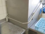 an image of a kitchen with a sink and a freezer