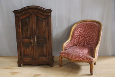a chair and a cabinet in a room