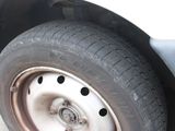 a close up of a tire on a car ' s rim