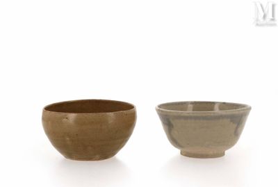 two bowls sitting next to each other on a white surface