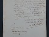 a piece of paper with writing on it sitting on top of a table