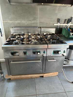 a stainless steel stove and oven in a kitchen