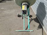 a machine that is sitting on the ground next to a building