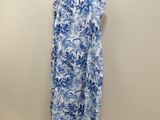a blue and white floral dress hanging on a hanger