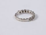 a close up of a silver ring on a white surface
