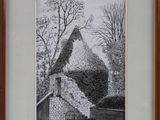 painting of a stone building in a wood frame on a wall
