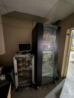 an image of a refrigerator and a computer in a room