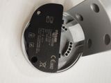 a close up of a metal object with a black tag on it