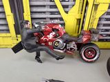 a figurine of a man riding a motorcycle in a garage