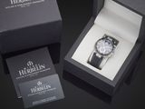a black box with a watch inside of it