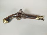 a close up of a toy gun on a white surface