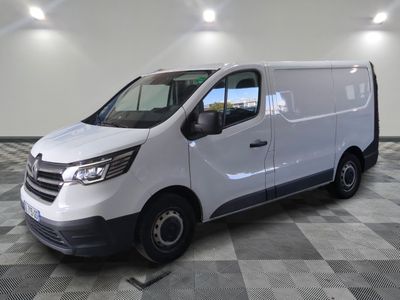 the white van is parked on a checkered floor in a room