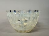 a glass bowl that is sitting on a table