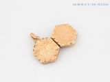 two gold lockes on a white surface with a white background