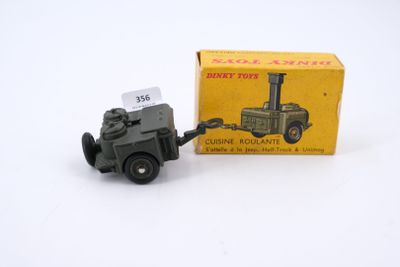 a small toy truck that is sitting next to a box