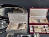 a silver tray with spoons and spoons in it