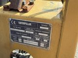 a close up of a yellow machine with a sign on it