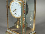 a clock that is sitting inside of a glass case