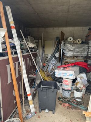 a garage with a lot of junk in it