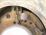 a close up of a metal object with a button on it