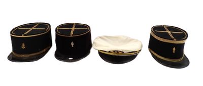 three hats sitting next to each other on a white surface