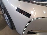 a close up of a car ' s bumper with a sticker on it