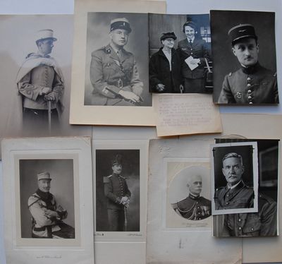 several old black and white photos of men in military uniforms