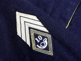 a close up of a tie with a monogram on it