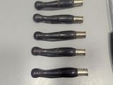 five knives and a knife sharper on a table