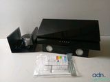 a picture of a black computer and some other items on the table