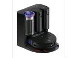 an image of a black coffee maker with two cups on it