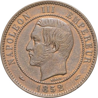 a close up of a coin with a woman ' s face on it