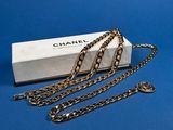 a close up of a box with a chain on a blue surface