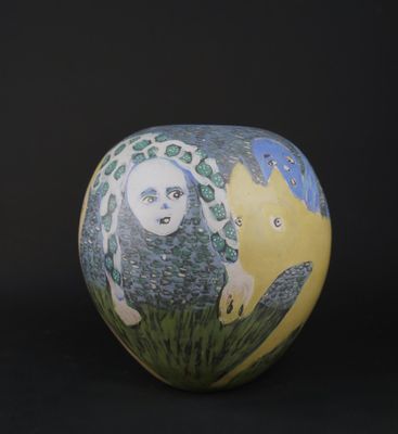 a vase with a picture of a woman and a cat on it