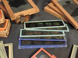 a pile of old photo frames on the floor